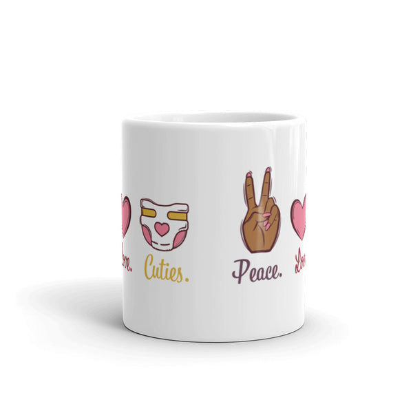 Side view of  our glossy white 11 oz mug that reads Peace. Love. Cuties.